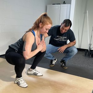mark diffley teaching the squat