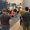 nick delgadillo teaching how to coach the squat