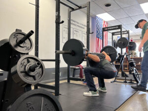 connor king coaching the squat